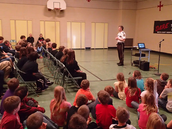 Troy speaking at the St. John's DARE culmination